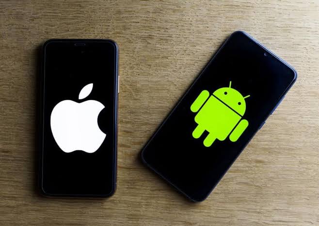 An iPhone showing the Apple logo beside an Android phone showing the Android robot logo