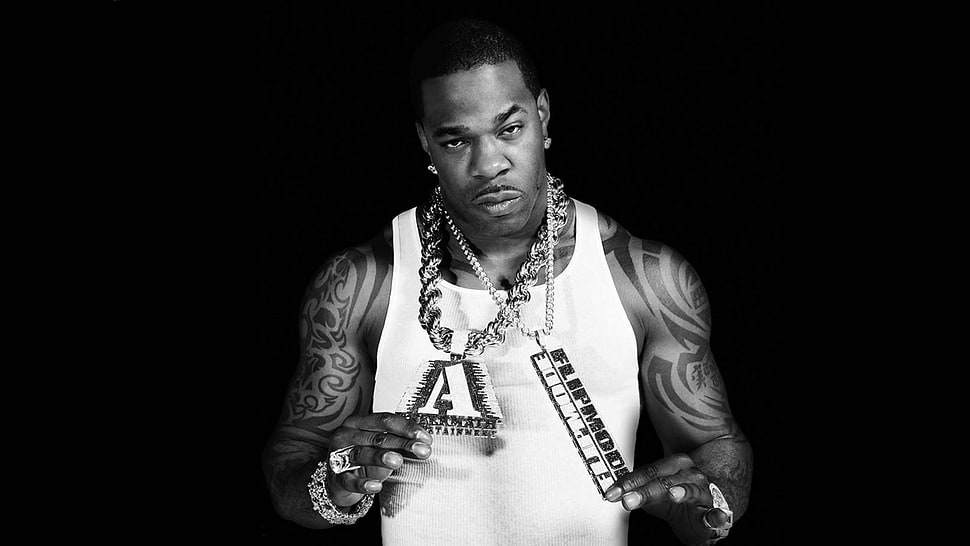 Busta Rhymes in black and white wearing chains