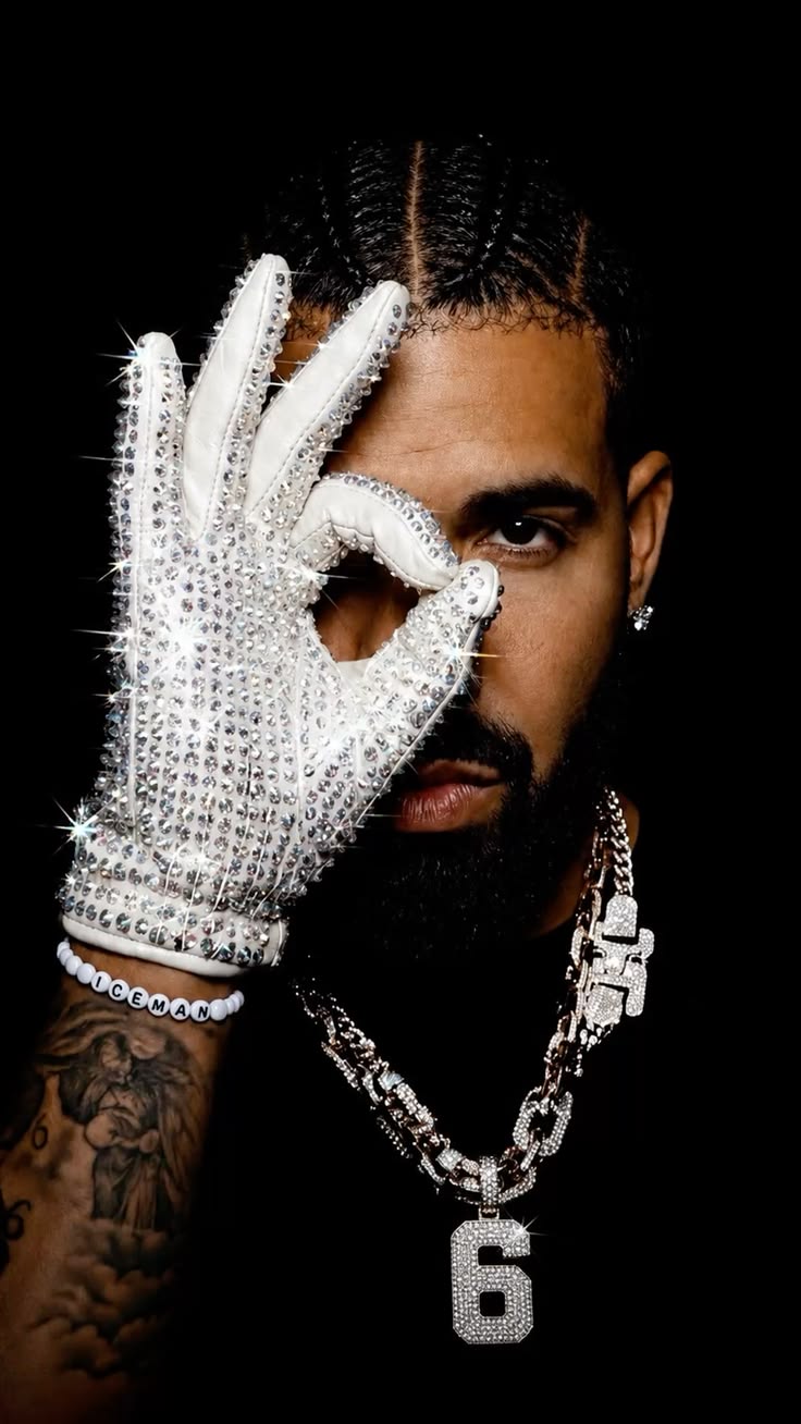 Drake wearing a crystal glove and number six chain